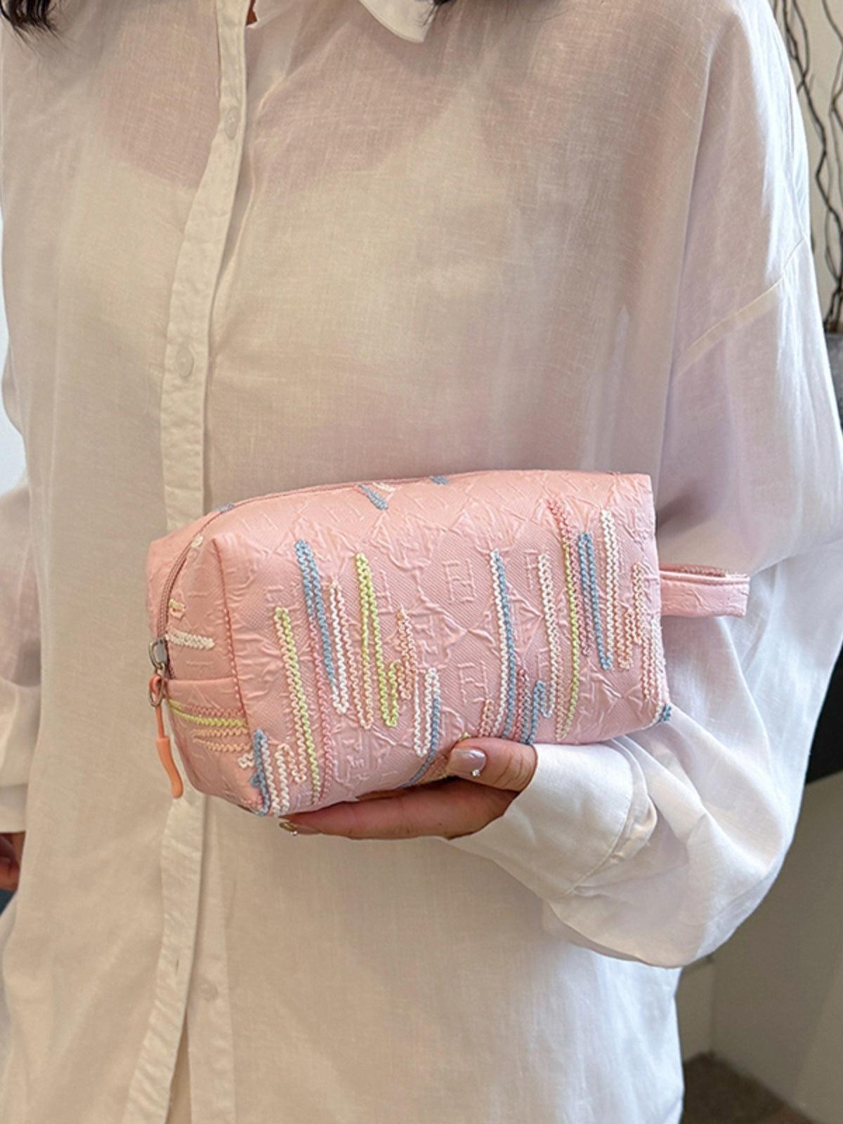 Pochette-bracelet en polyester contrastée avec fermeture éclair