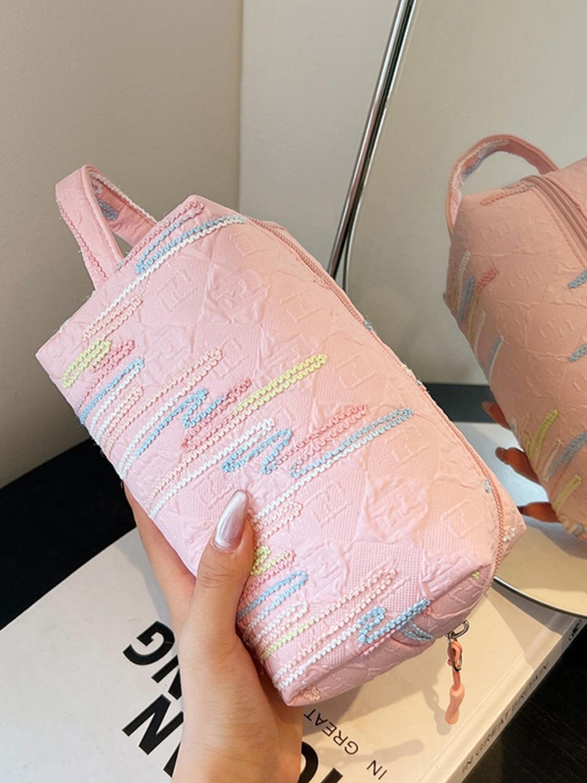 Pochette-bracelet en polyester contrastée avec fermeture éclair