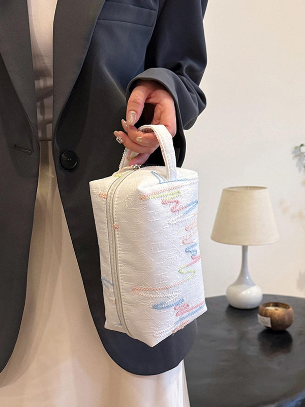Pochette-bracelet en polyester contrastée avec fermeture éclair