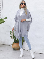 Poncho à capuche boutonné avec bordure à franges