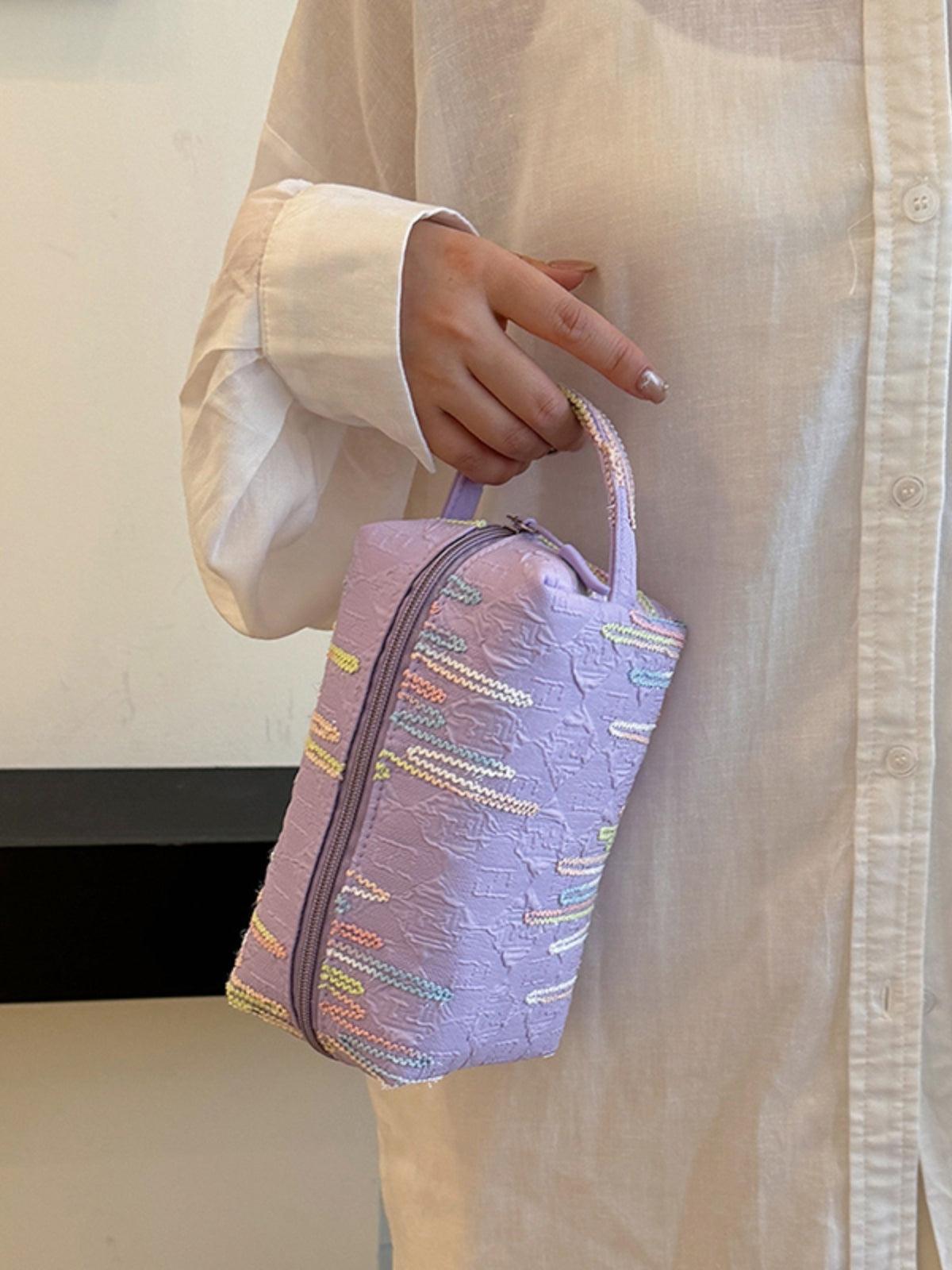 Pochette-bracelet en polyester contrastée avec fermeture éclair