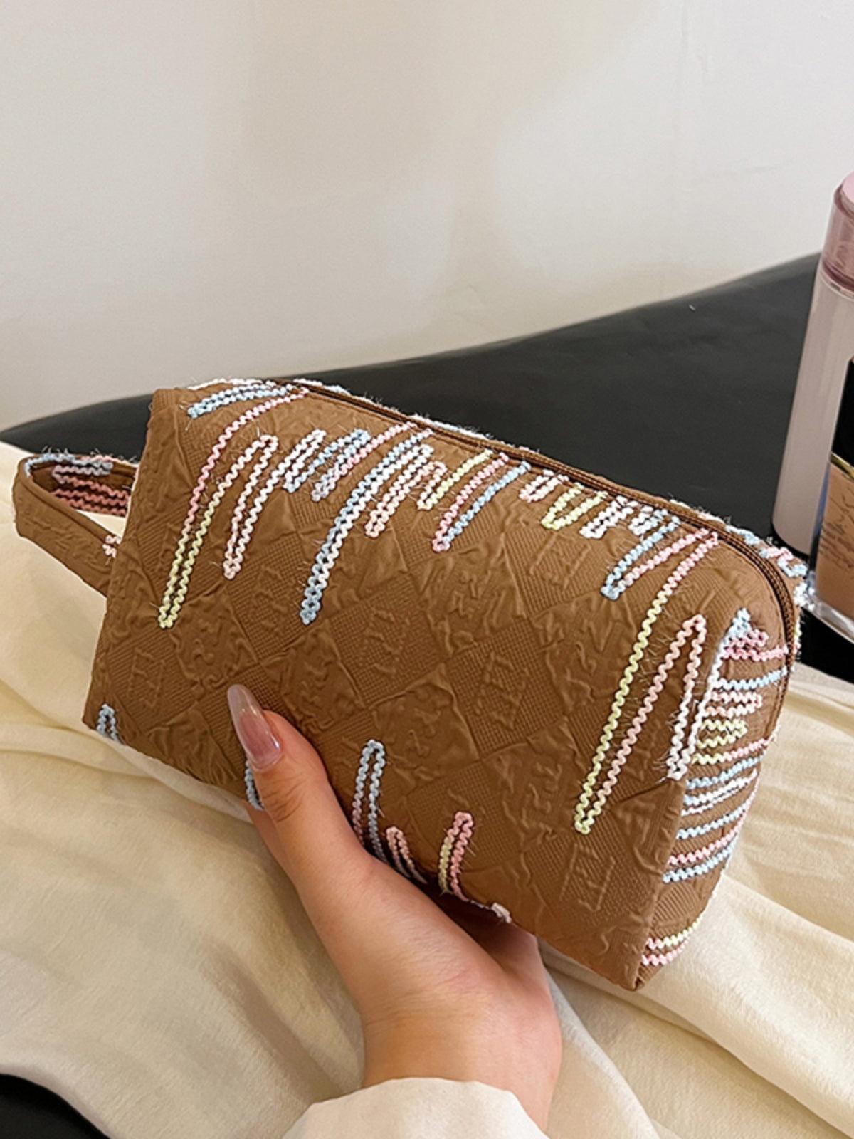 Pochette-bracelet en polyester contrastée avec fermeture éclair