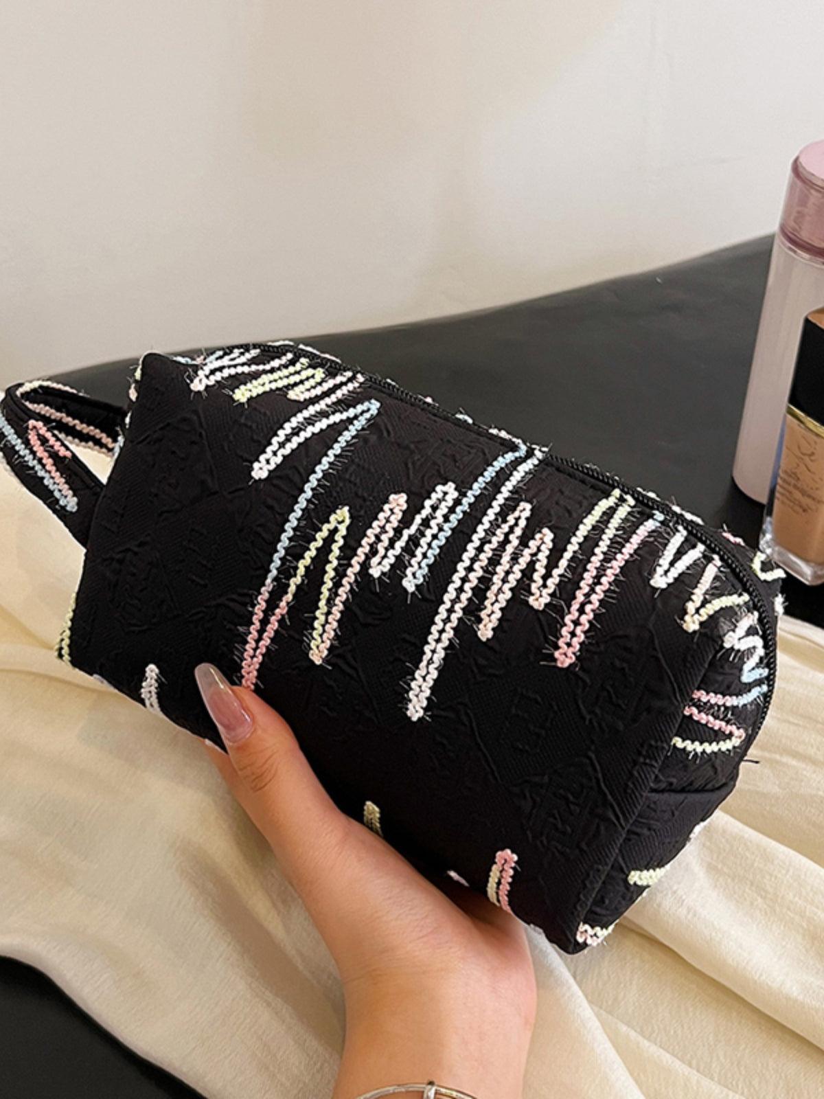 Pochette-bracelet en polyester contrastée avec fermeture éclair