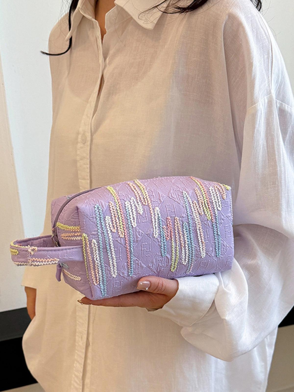 Pochette-bracelet en polyester contrastée avec fermeture éclair