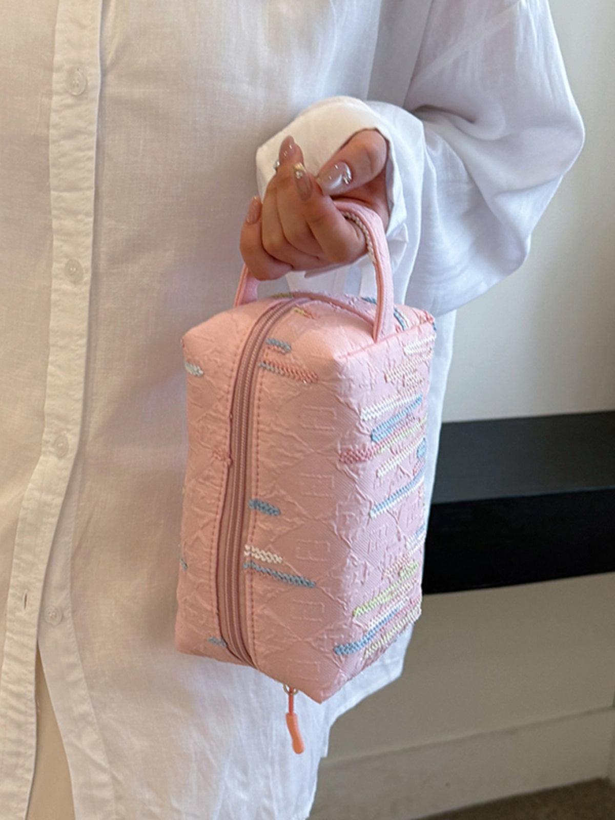 Pochette-bracelet en polyester contrastée avec fermeture éclair