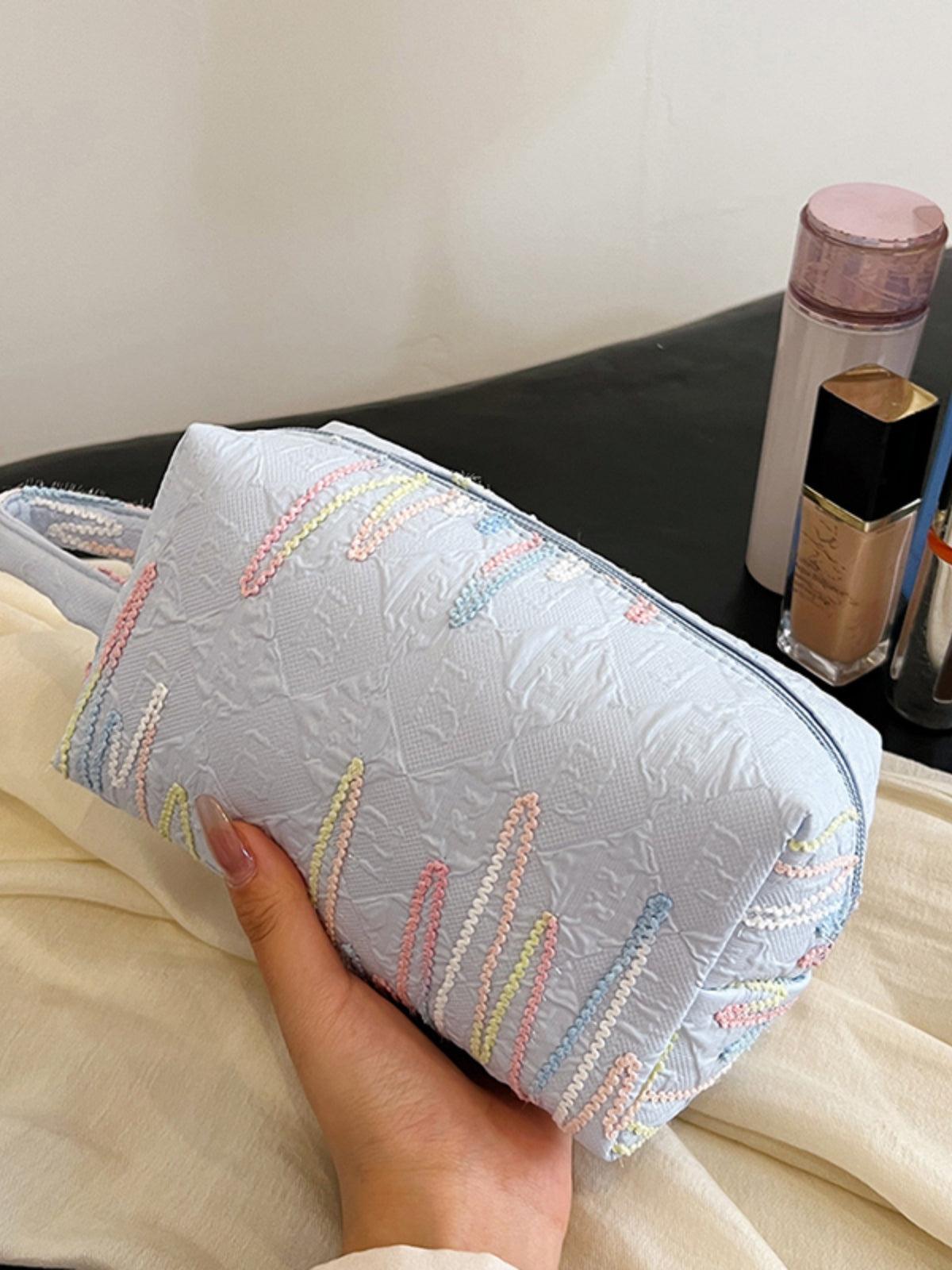 Pochette-bracelet en polyester contrastée avec fermeture éclair