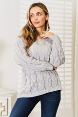 Pull à capuche en maille torsadée tissée à droite