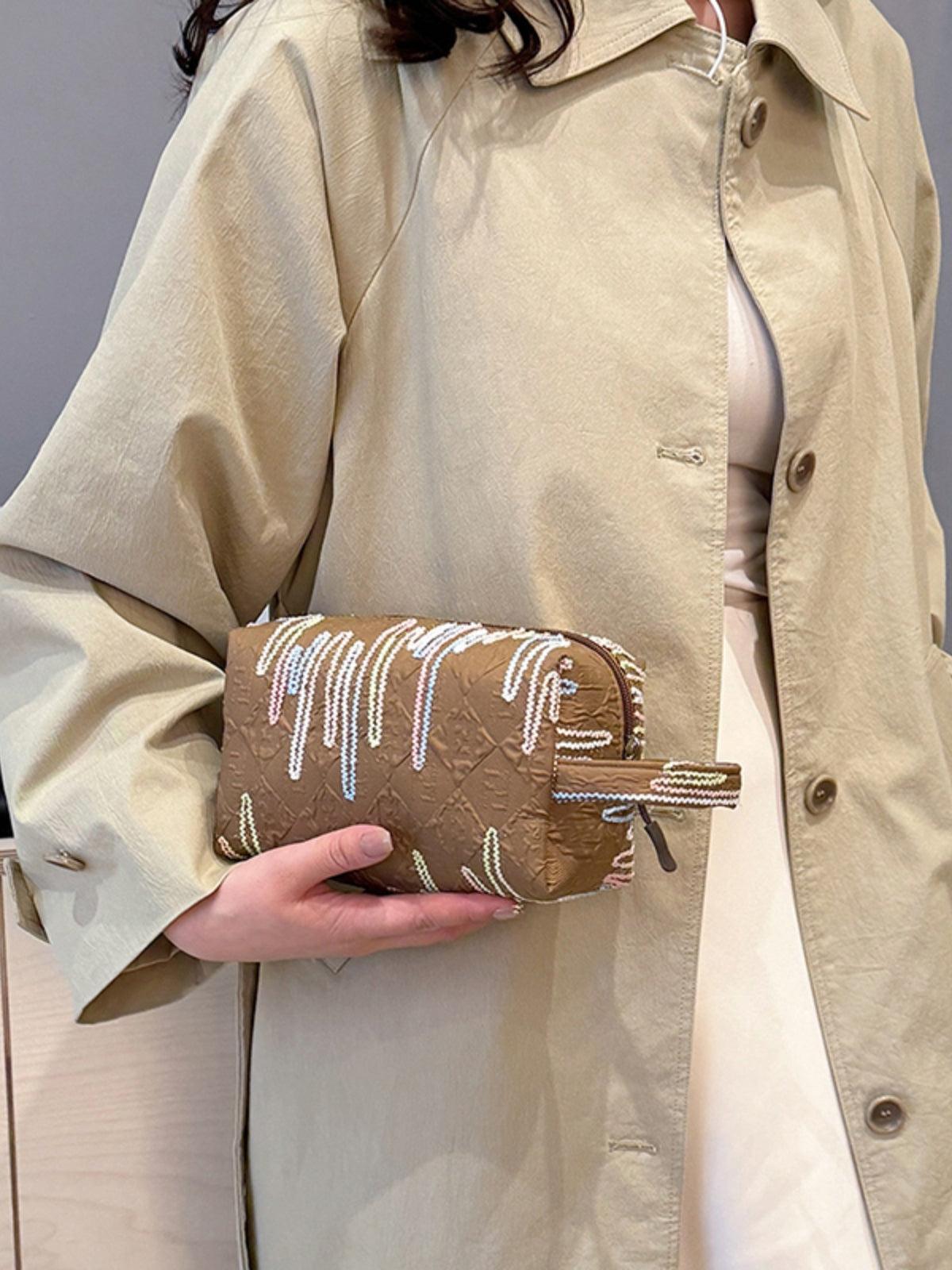 Pochette-bracelet en polyester contrastée avec fermeture éclair