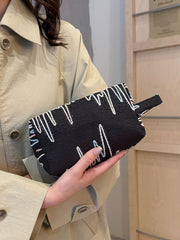 Pochette-bracelet en polyester contrastée avec fermeture éclair