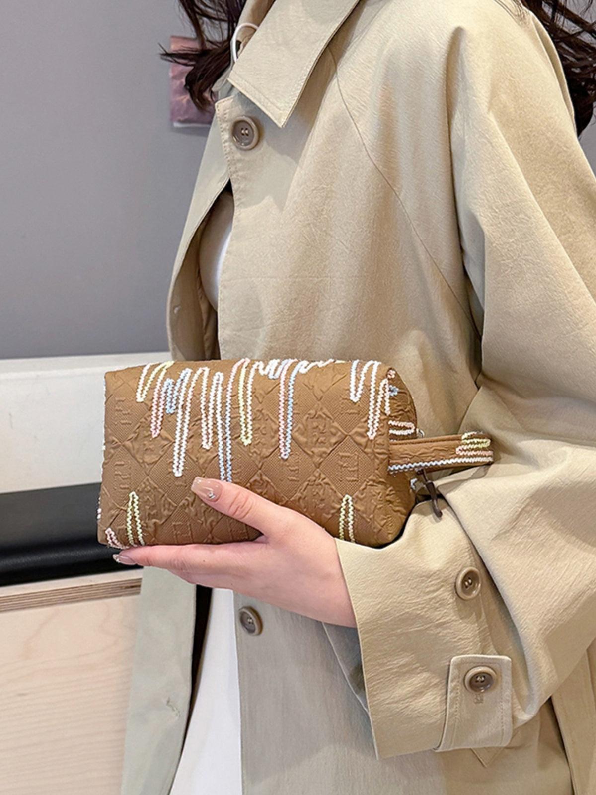 Pochette-bracelet en polyester contrastée avec fermeture éclair